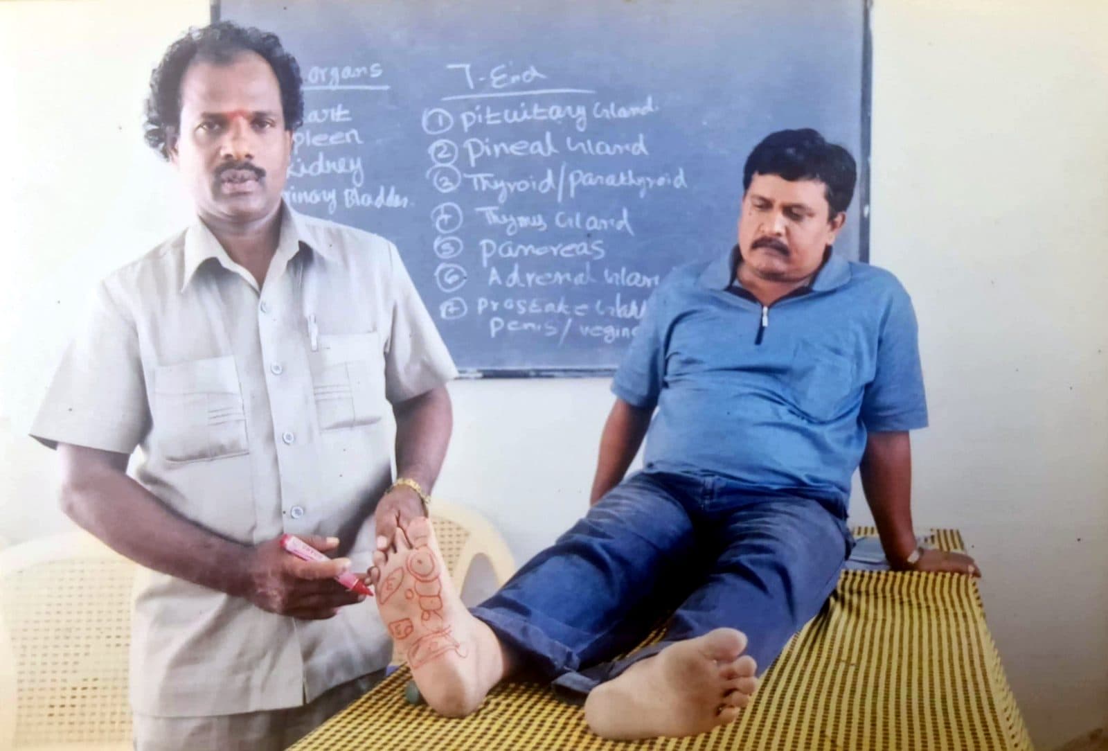 Dr. S. Ravichandran demonstrating foot reflexology zones